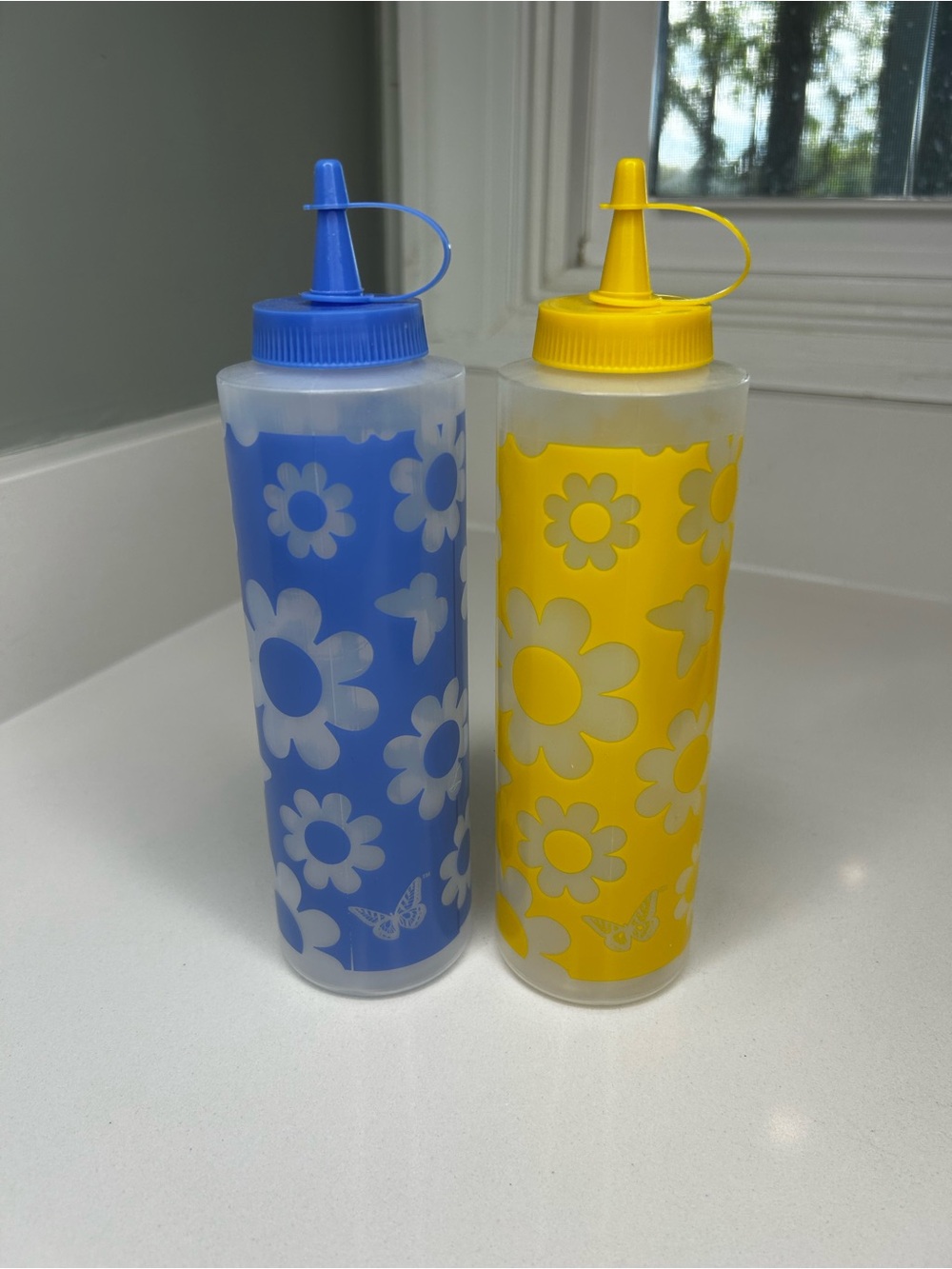 NEW Dolly Parton set of 2 Summer Floral blue and yellow Squeeze Bottles